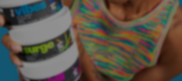 Person holding stacked supplement jars labeled 'vibes' and 'surge', wearing multicolor striped tank top