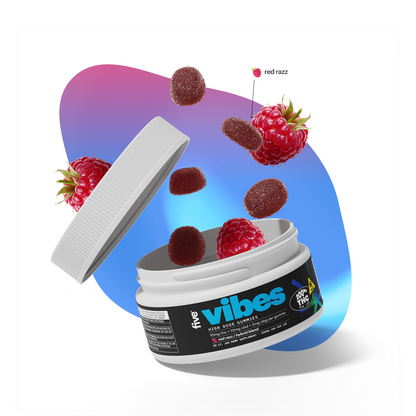 Open jar of vibes raspberry gummies with loose gummies and raspberries; label reads vibes, callout red razz, and THC.