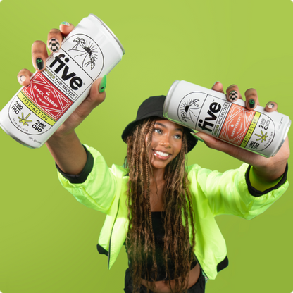 Woman holding two Five cans labeled five; BLACK CHERRY FAST-ACTING 2MG CBD and five; GRAPEFRUIT ELEVATED THC SELTZER 5MG THC